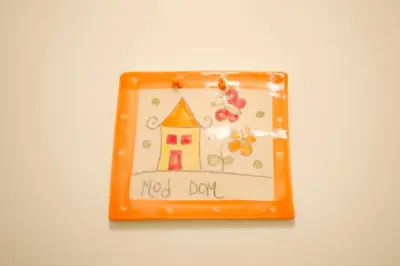 an orange box with a picture of a house at The cute, sunny apartment in the center +P in Ljubljana