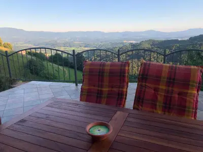 a table and chairs on a balcony with a view at Holiday home in Srednje Grcevje - Kranjska Krain 26064 in Srednje Grčevje