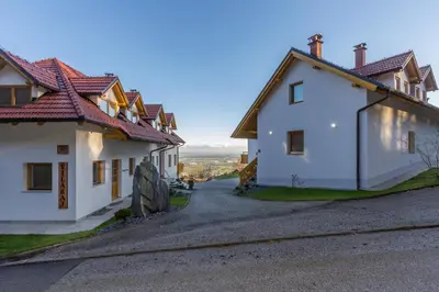 a view of two white houses and a street at Vilaraj in Maribor