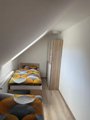 two bunk beds in a room with a staircase at Apartmaji Biseri in Kranjska Gora