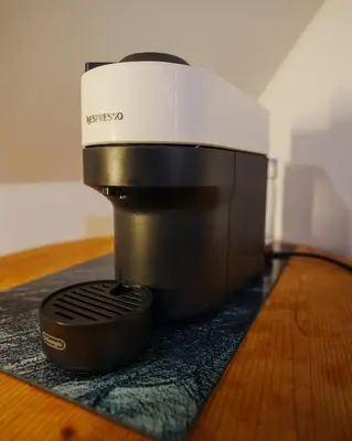 a coffee maker sitting on top of a table at Podlipnik Apartments in Kranjska Gora