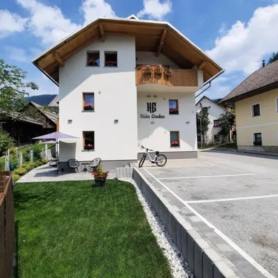 a building with a bike parked in front of it at House Godec - Rateče Planica in Kranjska Gora