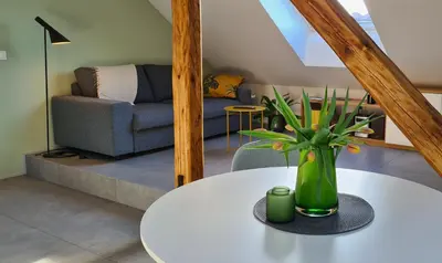 a living room with a table and a couch at Relax & Enjoy Ljubljana in Ljubljana