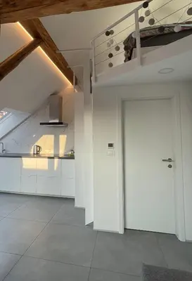 a hallway with white cabinets and a white door at Relax & Enjoy Ljubljana in Ljubljana
