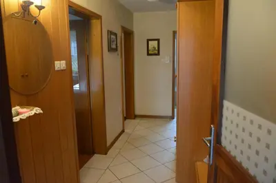 a hallway with two doors and a tile floor at Apartment Ljubljana Marsh Nature Park in Brest