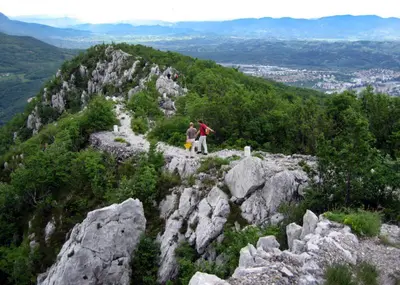 two people standing on top of a mountain at Pri Martinovih in Deskle