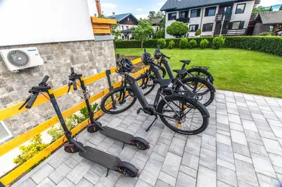 a group of bikes parked next to a fence at Apartments Ursus in Bled
