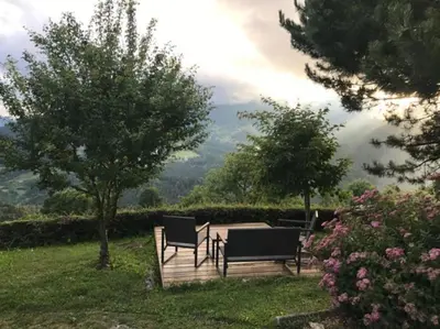 a group of chairs and a table in a yard at House Pucnk-beautiful countryside in Železniki