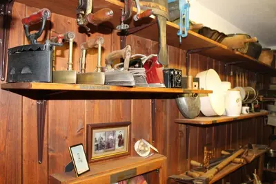 a shelf with shoes and other items on it at House Pucnk-beautiful countryside in Železniki