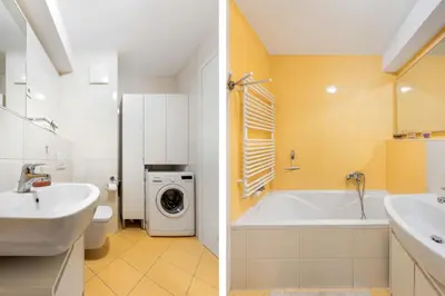 a bathroom with a sink and a washing machine at Attractive Njegoševa Apartment with a Balcony in Ljubljana
