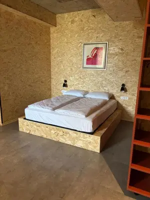 a bedroom with a large bed in a room at Delo 2.0. in Ljubljana