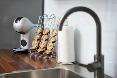 a bunch of donuts in a rack next to a sink at 47 Heaven Luxury House in Radovljica