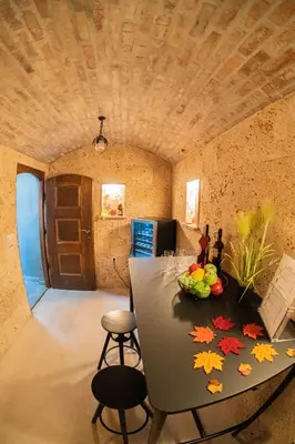 a kitchen with a table with a bowl of fruit on it at 47 Heaven Luxury House in Radovljica