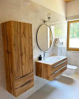 a bathroom with a sink and a mirror at ALPS Apartments in Kranjska Gora