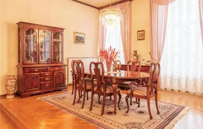 a dining room with a table and chairs and a chandelier at Beautiful Home In Obrov in Obrov