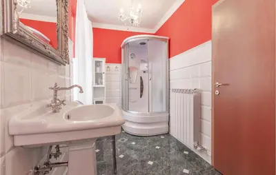 a bathroom with a sink and a shower at Beautiful Home In Obrov in Obrov