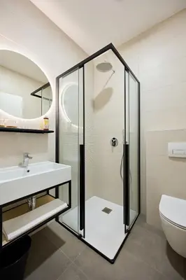 a bathroom with a shower and a sink at Na trati Pension in Črna na Koroškem