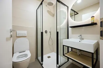 a bathroom with a toilet and a sink at Na trati Pension in Črna na Koroškem