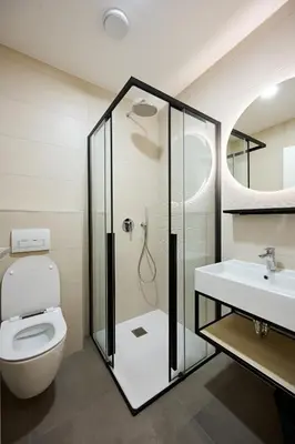 a bathroom with a shower and a toilet and a sink at Na trati Pension in Črna na Koroškem