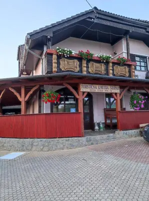 a building with flower boxes on the front of it at Turistična kmetija Štupar in Dvor