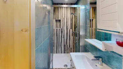 a bathroom with a sink and a shower at hiša Margit, Rateče 150 in Rateče
