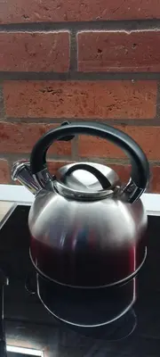 a tea pot sitting on top of a stove at hiša Margit, Rateče 150 in Rateče