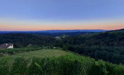 a view from the top of a hill at sunset at Hiška oddiha - Rest house in Sromlje
