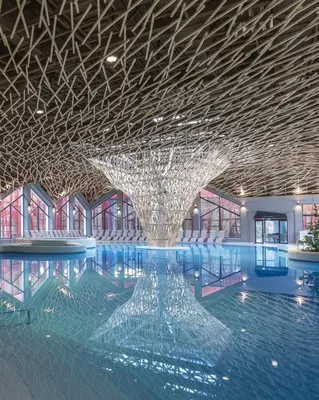 a large glass fountain in a building with a ceiling at E79 AQUALUNA KAMP NATURA PODČETRTEK card not included in Podčetrtek