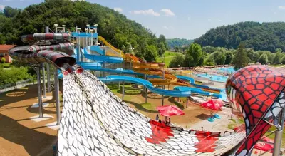 a large water park with a water slide at E79 AQUALUNA KAMP NATURA PODČETRTEK card not included in Podčetrtek