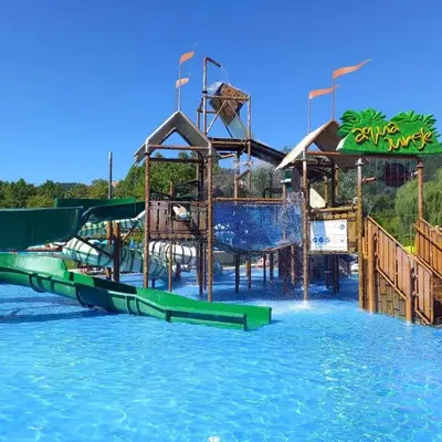 a water park with a water slide in the water at E79 AQUALUNA KAMP NATURA PODČETRTEK card not included in Podčetrtek