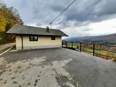 a small house on the side of a road at Vineyard cottage Kulovec in Uršna Sela