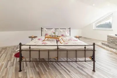 a bedroom with a bed in a room at Holiday House Vikend in Polzela