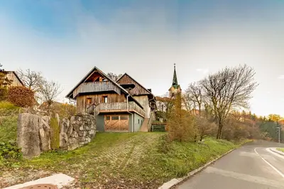 an old house on the side of a road at Svisla in Kranj