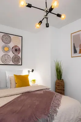 a bedroom with a bed and a ceiling fan at Apartmaji Spalina, Ivančna Gorica in Veliko Črnelo
