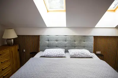 a bedroom with a bed with two pillows at Apartment - Golden Fox 18 - Pohorske terase in Pohorje