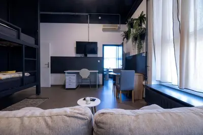 a living room with a couch and a table at Hostel Veronika Celje in Celje