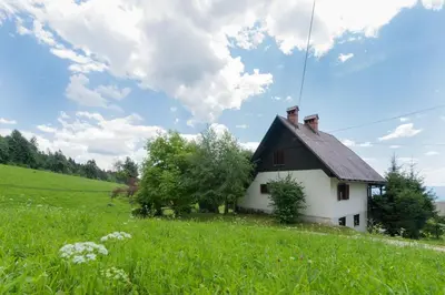 a house on a hill in a field at Chalet Vista in Cerklje na Gorenjskem