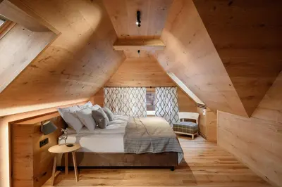 a bedroom with a bed in an attic at Vila Pavlina in Kranjska Gora
