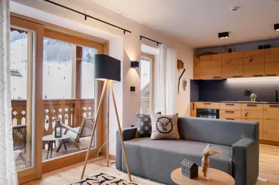 a living room with a couch and a table at Vila Pavlina in Kranjska Gora