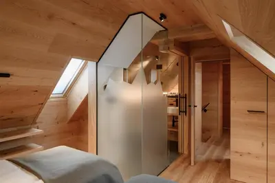 a room with a glass door in a wooden house at Vila Pavlina in Kranjska Gora