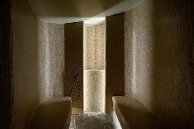 a bathroom with two chairs and a window at Vila Pavlina in Kranjska Gora