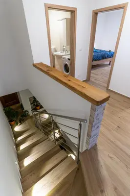 a staircase in a house with a mirror at Apartma Valič in Ajdovščina