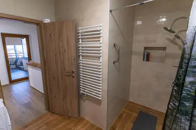 a bathroom with a shower with a glass door at Apartma Valič in Ajdovščina