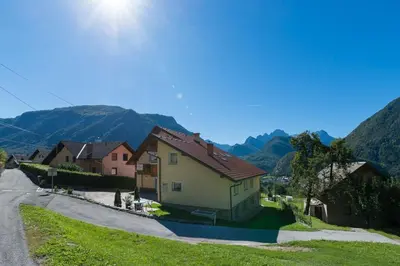 a group of houses on the side of a road at Ela Apartments - 1 in Kranjska Gora