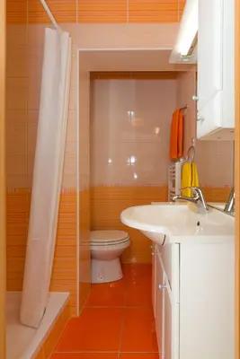 a bathroom with a toilet and a sink and a shower at Ela Apartments - 2 in Dovje