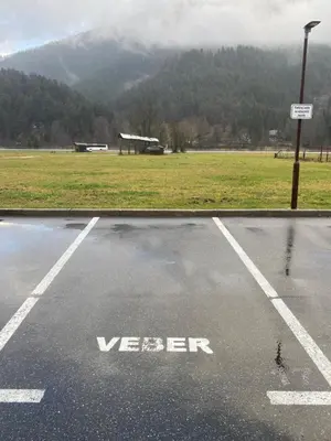 an empty parking lot with a view of a field at Sport & Sunny Cosy Alpine Retreat in Kranjska Gora