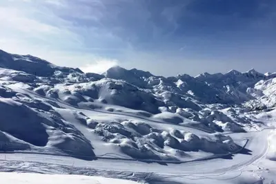 a snow covered mountain range with snow on it at Iglica Apartments - First Floor in Bohinjska Bela