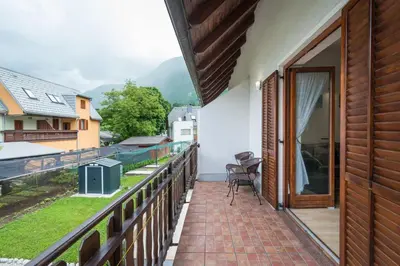 a balcony with a view of the mountains at Lepa Soca House in Čezsoča