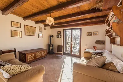 a living room with a couch and a table at Little Vista in Kojsko