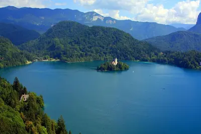 an island in the middle of a large lake at Sava View 8 in Ribno